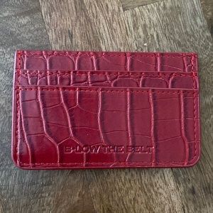 Small pocket size wallet in burgundy/red color.